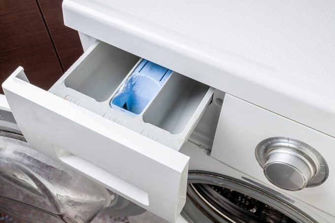washing machine drawer compartments. dirty washing powder tray. domestic handyman service. close up