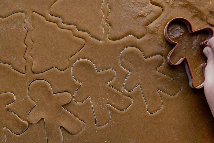 Making the Gingerbread Men Cuts on Rolled Dough with Gingerbread Men Cookie Cutter