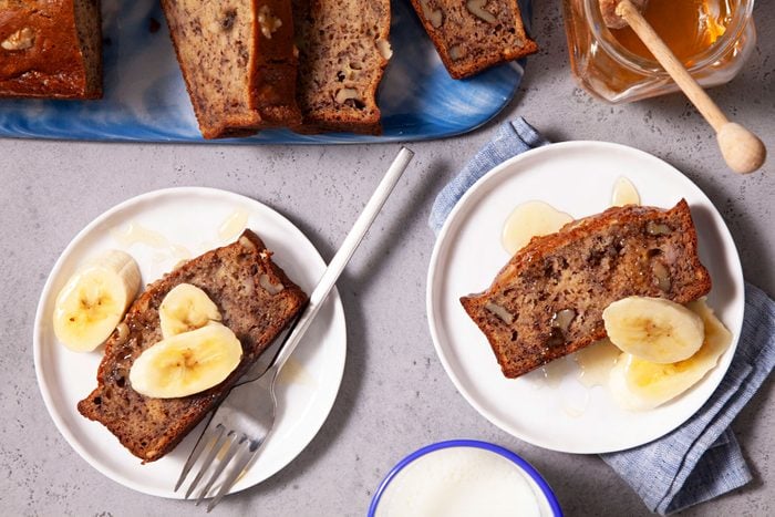 Gluten-Free Banana Bread with Banana Slices Served on Two Small Plates.