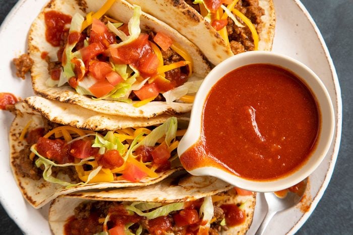 Homemade Taco Sauce served with Tacos on a plate