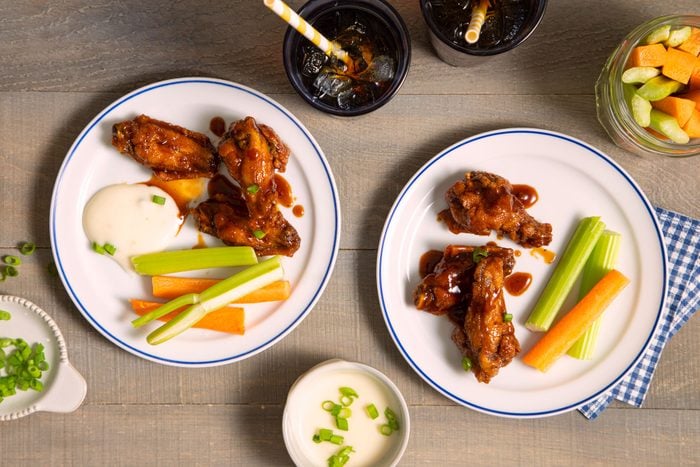 Honey Barbecue Chicken Wings served in white plates on a table