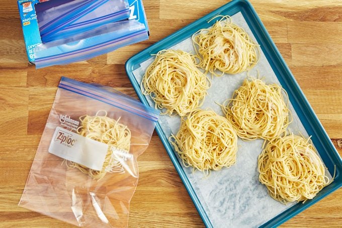 packaging cooled pasta nests into freezer safe bags