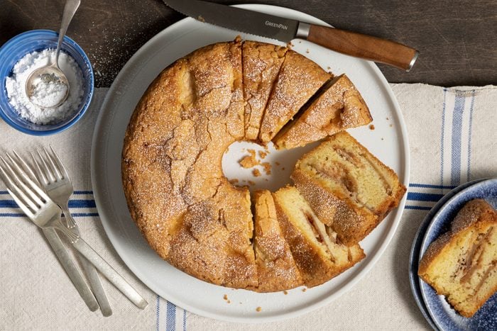 Jewish Apple Cake slices on a plate with a fork and a knife