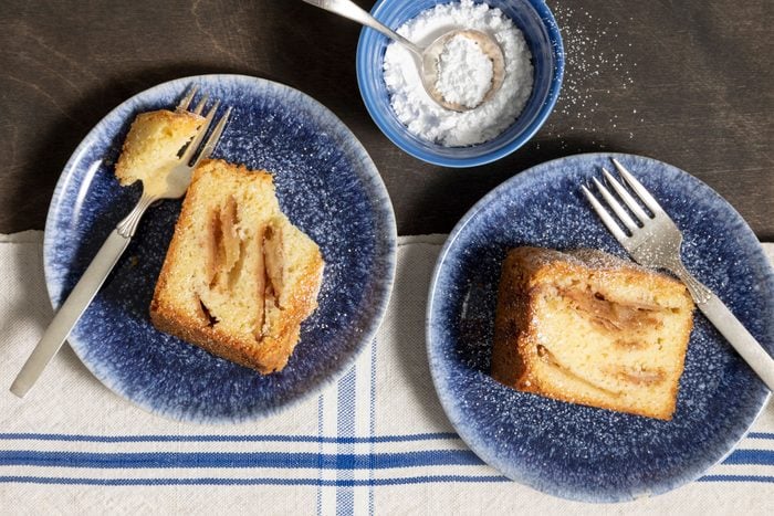Jewish Apple Cake slices served in bowls with fork