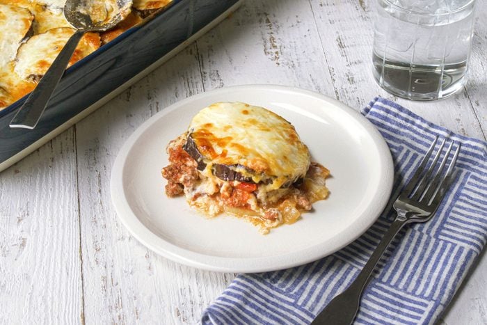 Delicious Moussaka dish on a plate with a fork