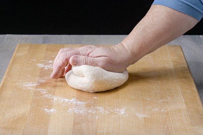 Knead the dough on floured surface