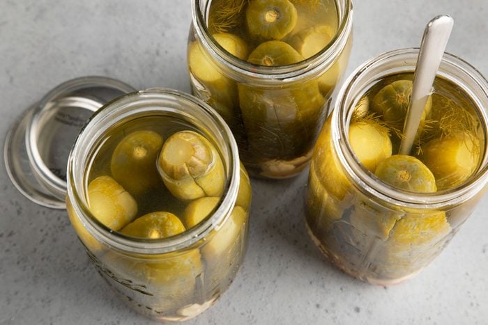 Old Fashioned Garlic Dill Pickles in jars opened up
