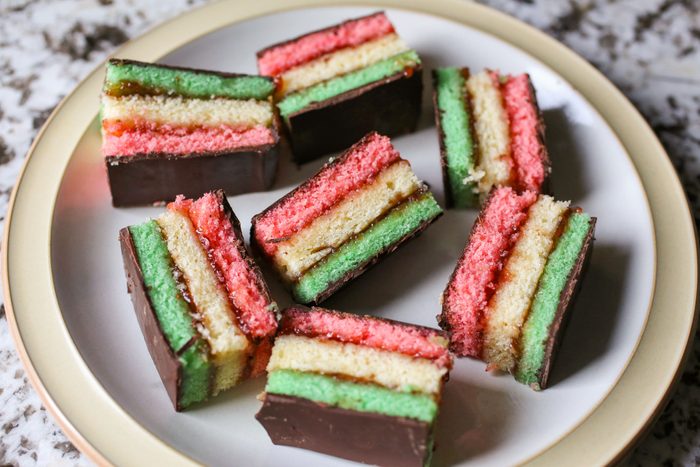 Lots of Passover Rainbow Cookies on a Plate on Marble Kitchen Countertop