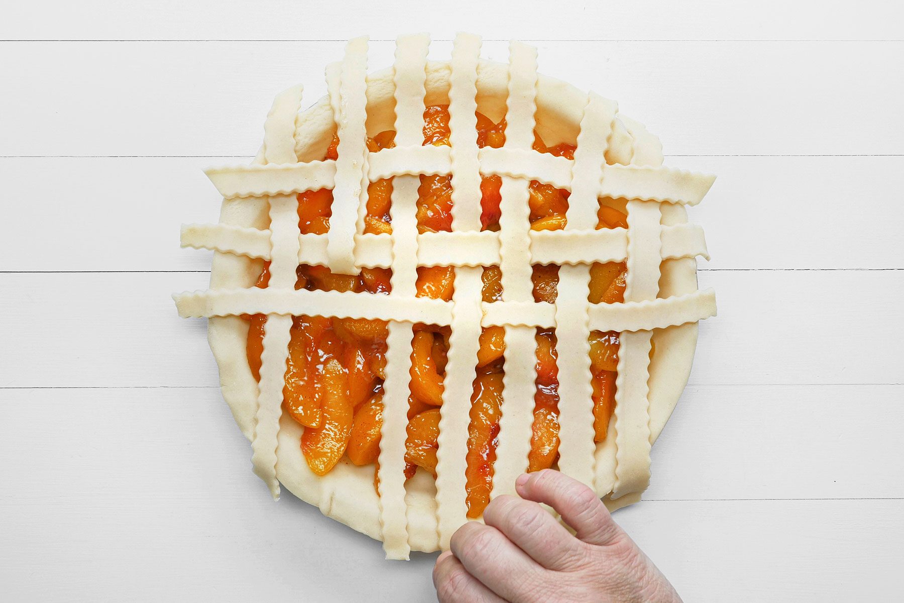 Setting dough strips on Pie