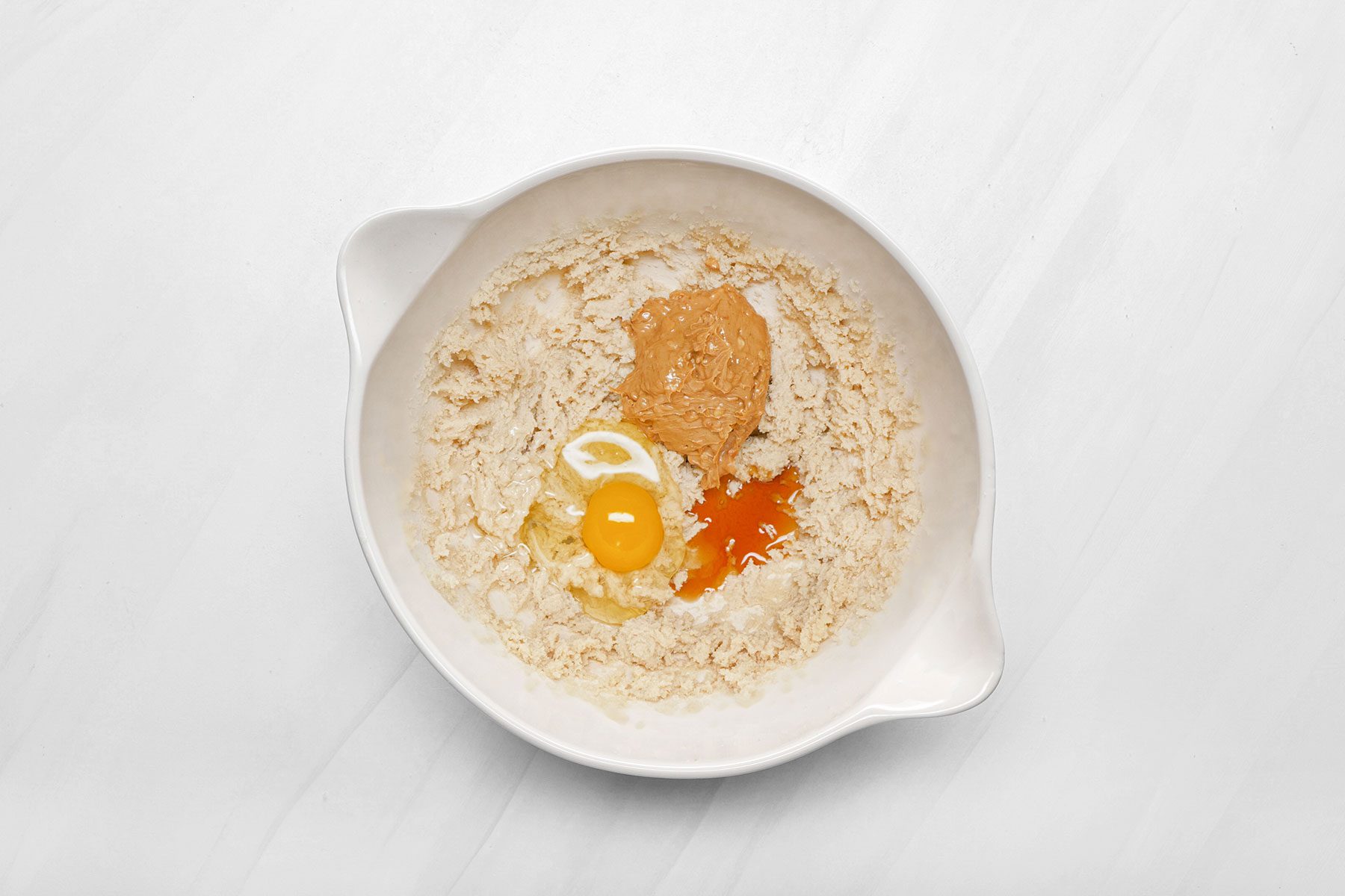 Egg, peanut butter and oats in bowl