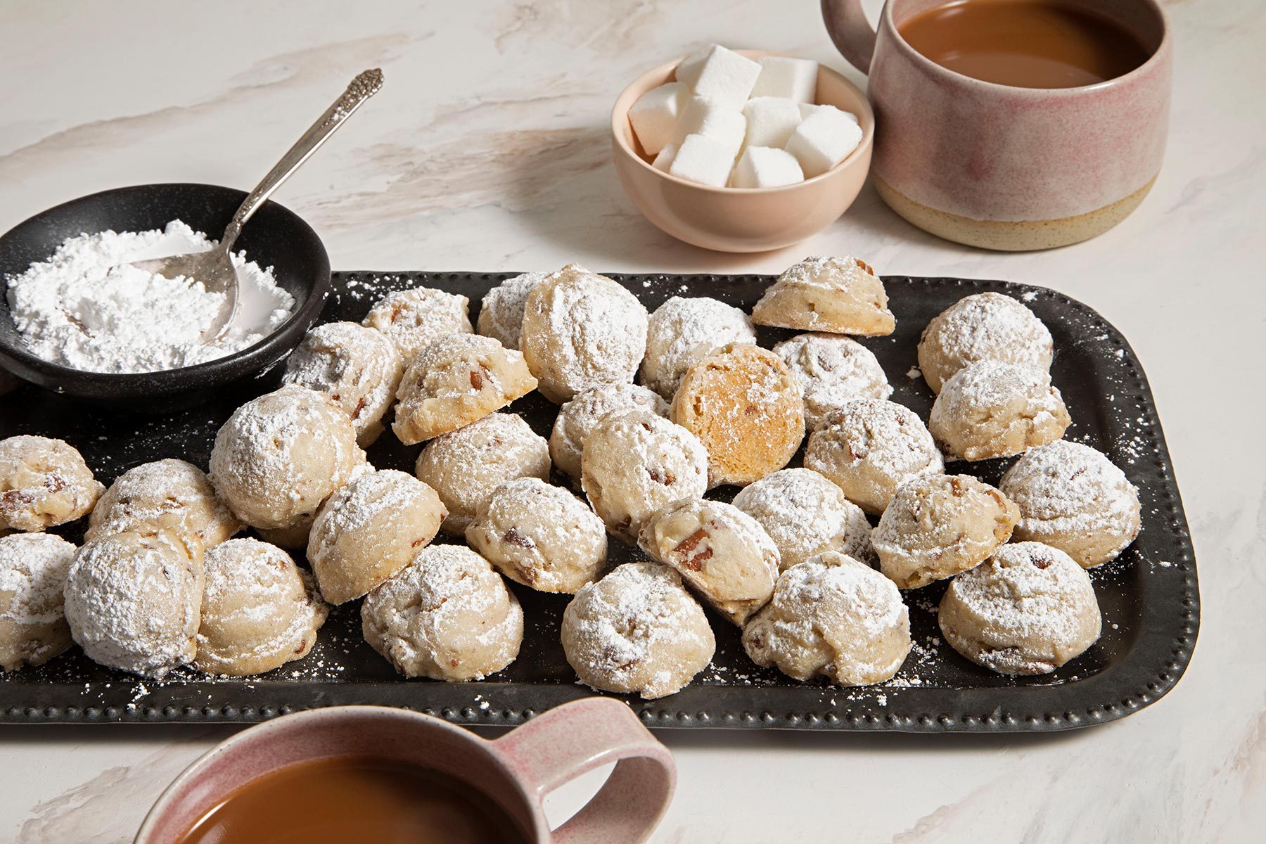 Pecan Sandies served on platter with hot chocolate and marshmallows