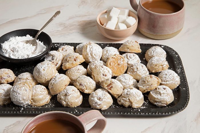 Pecan Sandies served on platter with hot chocolate and marshmallows