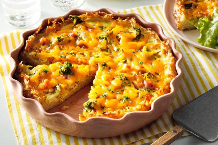 Potato Crust Quiche in baking sheet with drinks on side