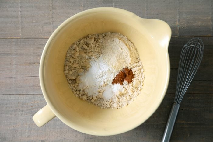 A bowl with almond flour, baking powder, baking soda, cinnamon and salt
