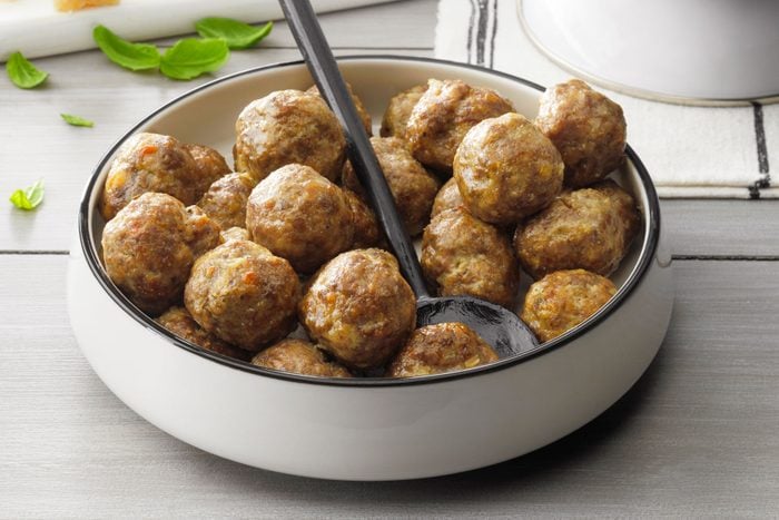 Meatballs served in a plate with a spoon