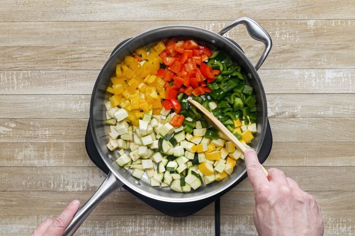 Saute eggplant, zucchini, squash and peppers in a large skillet