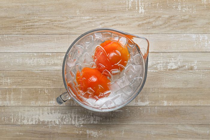 Immediately plunge the tomatoes into ice water