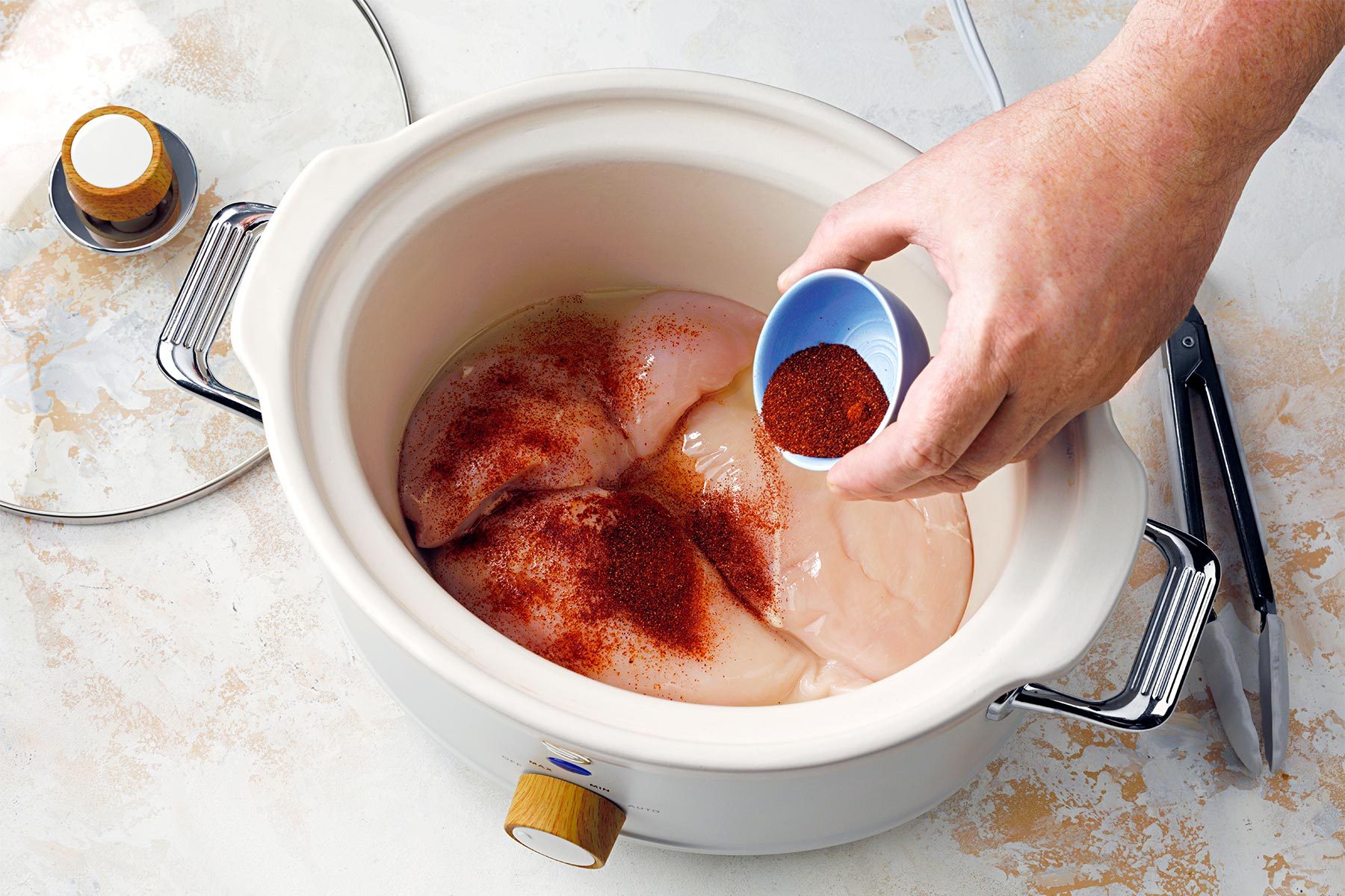 Adding spices to chicken breasts in slow cooker