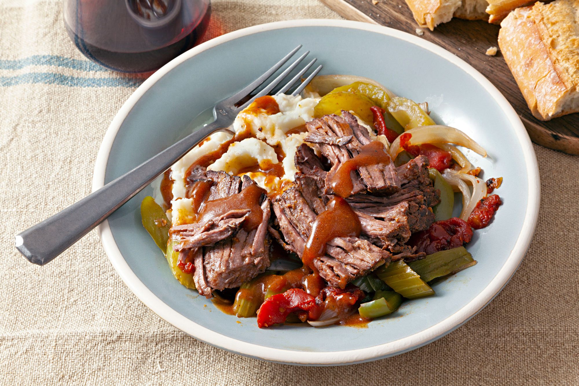 A bowl of Slow Cooker Chuck Roast with meat and vegetables