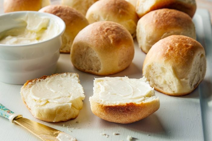 Soft Buttermilk Dinner Rolls served with butter on a table
