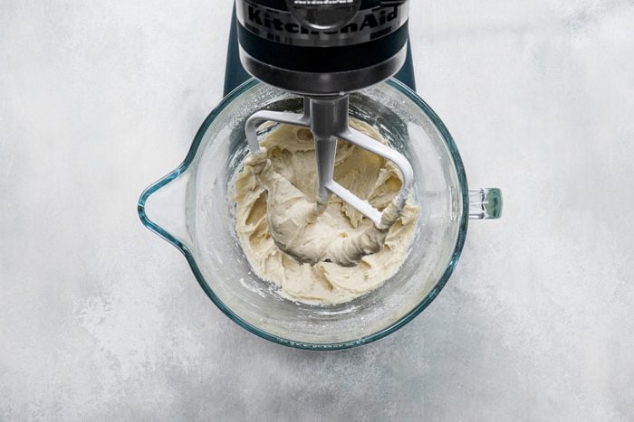 Preparing the dough in a large bowl using a stand mixer