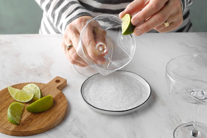 Rubbing Lemon on rim of the glass