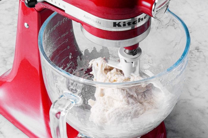 pizza dough in a red stand up mixer
