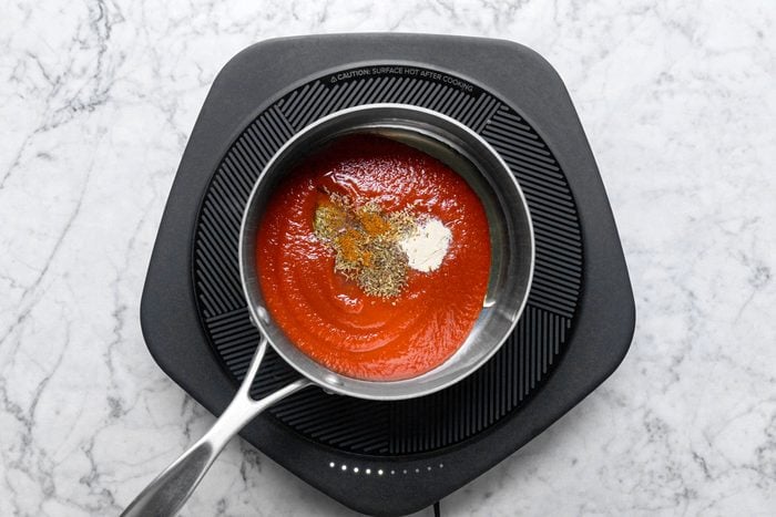 making sauce in a pan on a hot plate