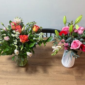 Two Bouquets of flowers on wooden table