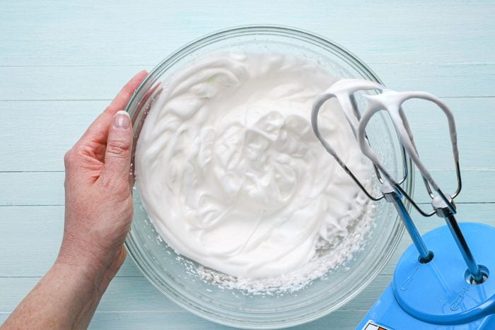 beating egg whites in a glass bowl until stiff peaks form