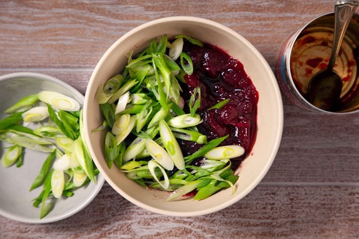Stir together the cranberry sauce and green onions