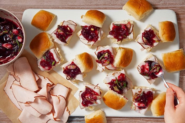 Assemble the sliced turkey, cranberry mixture and the roll’s tops