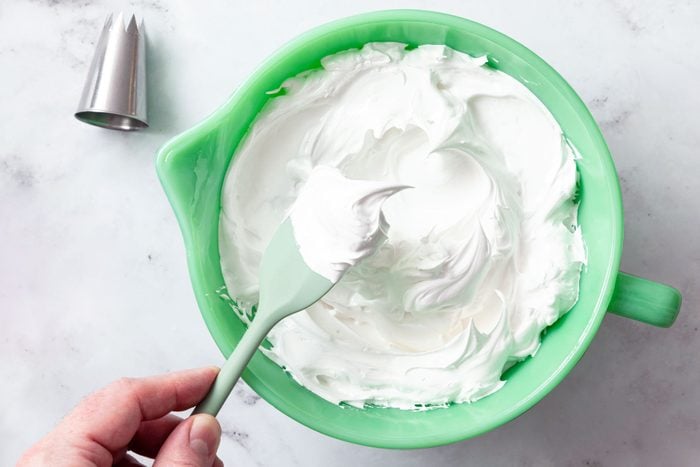 Glossy Vanilla mixture foam in a large green bowl