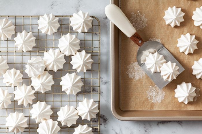 Vanilla Meringue Cookies placed on a cooling tray after baking