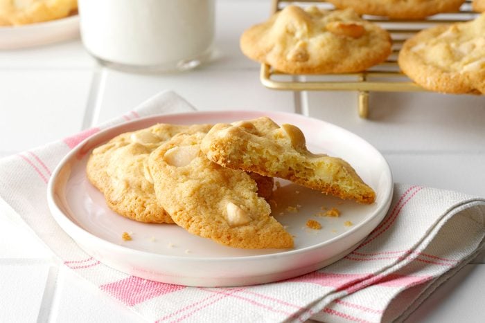 White Chocolate Macadamia Nut Cookies served on plate with glass of milk