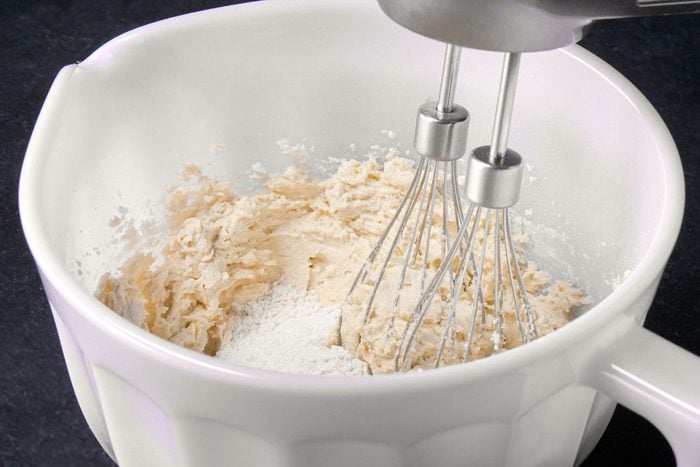 Whisking flour in bowl