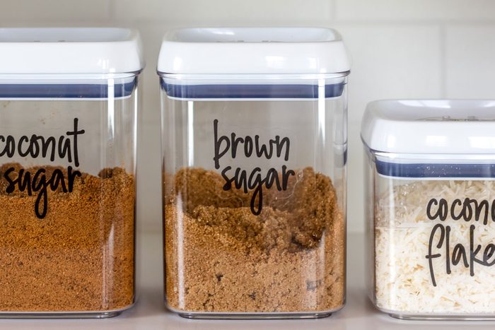 Neatly Organized Transparent Airtight Canisters For Baking Ingredients in a kitchen.