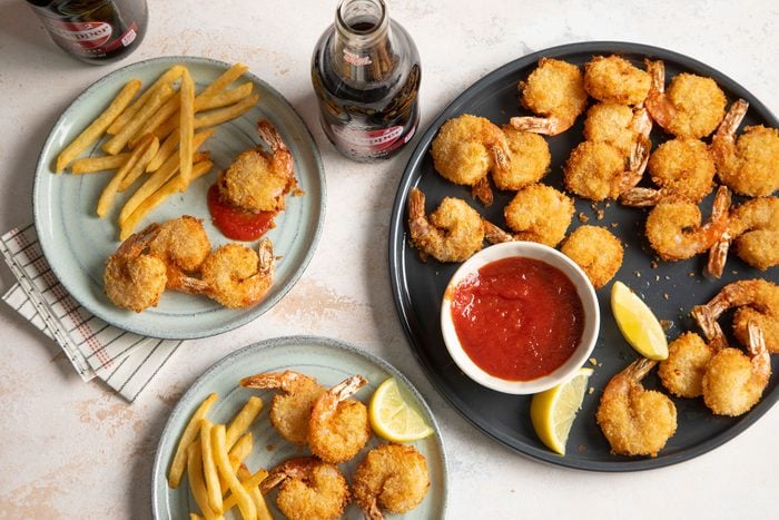 Air Fryer Popcorn Shrimp served with fries and cocktail