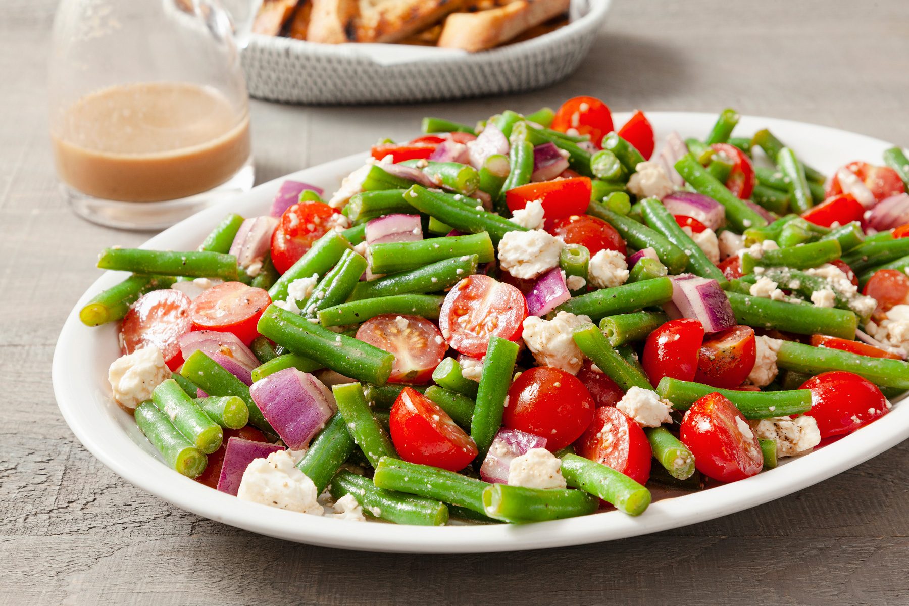 A plate of balsamic green bean salad on a table