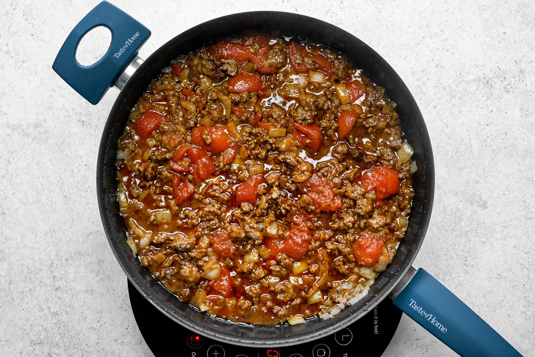 Spices added in Chopped onion and Beef mixture in a large skillet