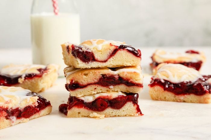Cherry Pie Bars served with a glass of milk