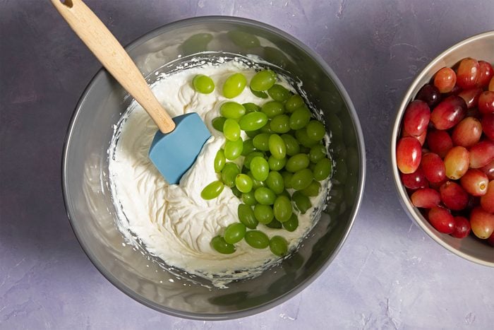 Bowl of blended cream with grapes in it