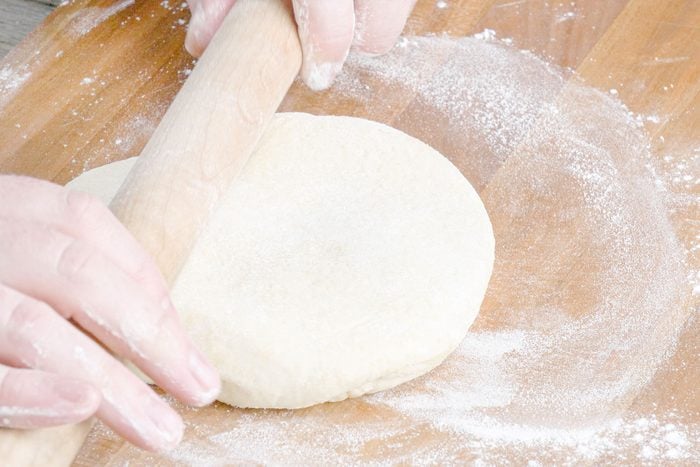 Rolling the dough with rolling pin