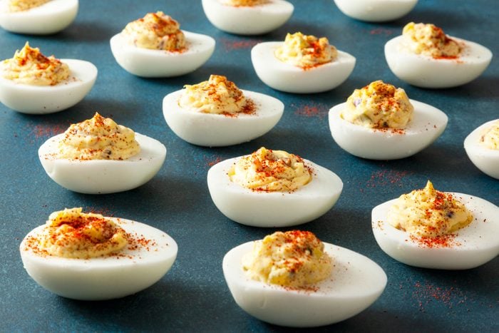 Deviled Eggs With Bacon arranged on a surface ready to serve
