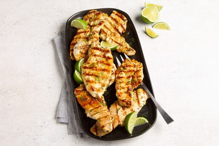 grilled chicken with lime on a serving platter