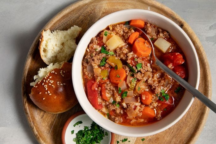 Hamburger Stew served in a bowl with a side of bread