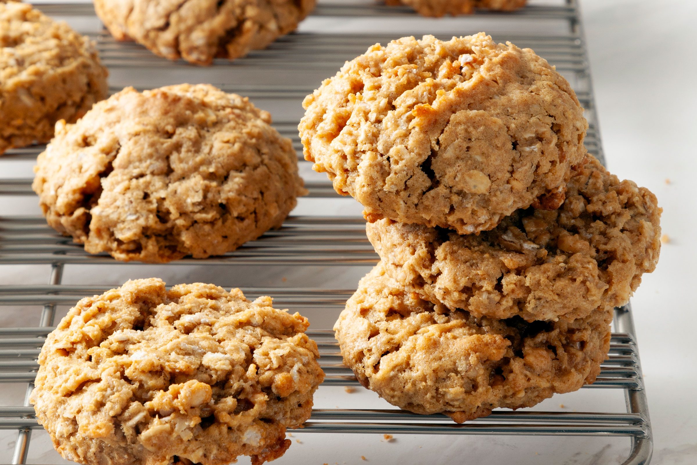 close up of Peanut Butter Oatmeal Cookies on a cooling rack