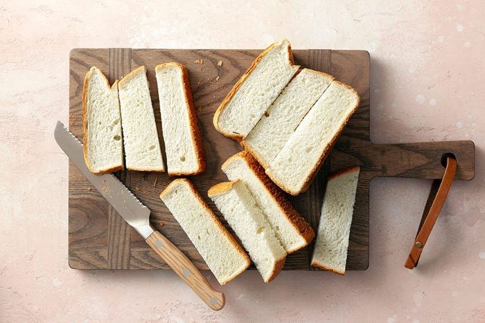 Slices of Bread on wooden chopping board
