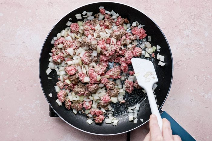 Cook beef and onion in a large skillet using a spoon