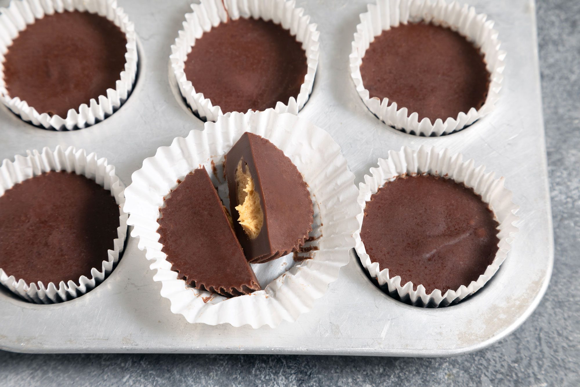 wide shot of homemade peanut butter cups in a muffin tray